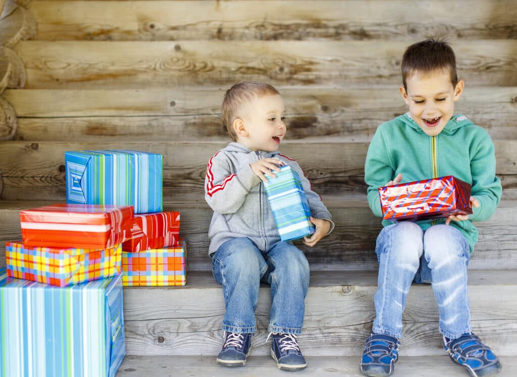Why Kylie Kelce refuses to give ‘sibling gifts’ and 10 alternatives for parents who agree | "I am vehemently against the idea of other kids getting birthday presents on a child's birthday.” Pregnancy News brothers opening presents