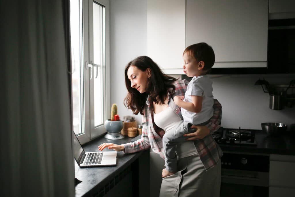 stay-at-home mom holding son