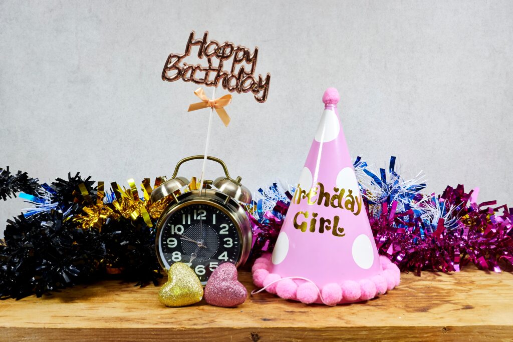 Why Kylie Kelce refuses to give ‘sibling gifts’ and 10 alternatives for parents who agree | "I am vehemently against the idea of other kids getting birthday presents on a child's birthday.” Pregnancy News pink party hat says birthday girl