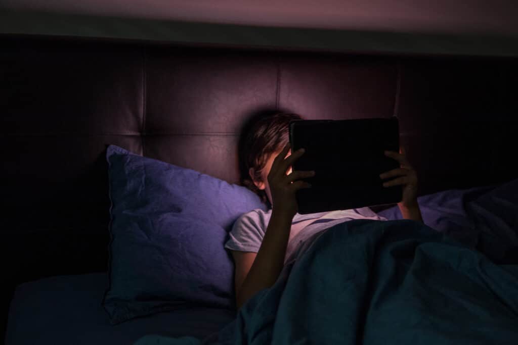 FBI closely monitoring dangerous online network ‘764’ that preys on children | "We see a lot of bad things, but this is one of the most disturbing things we're seeing.” Parenting young boy playing with tablet in bed 764