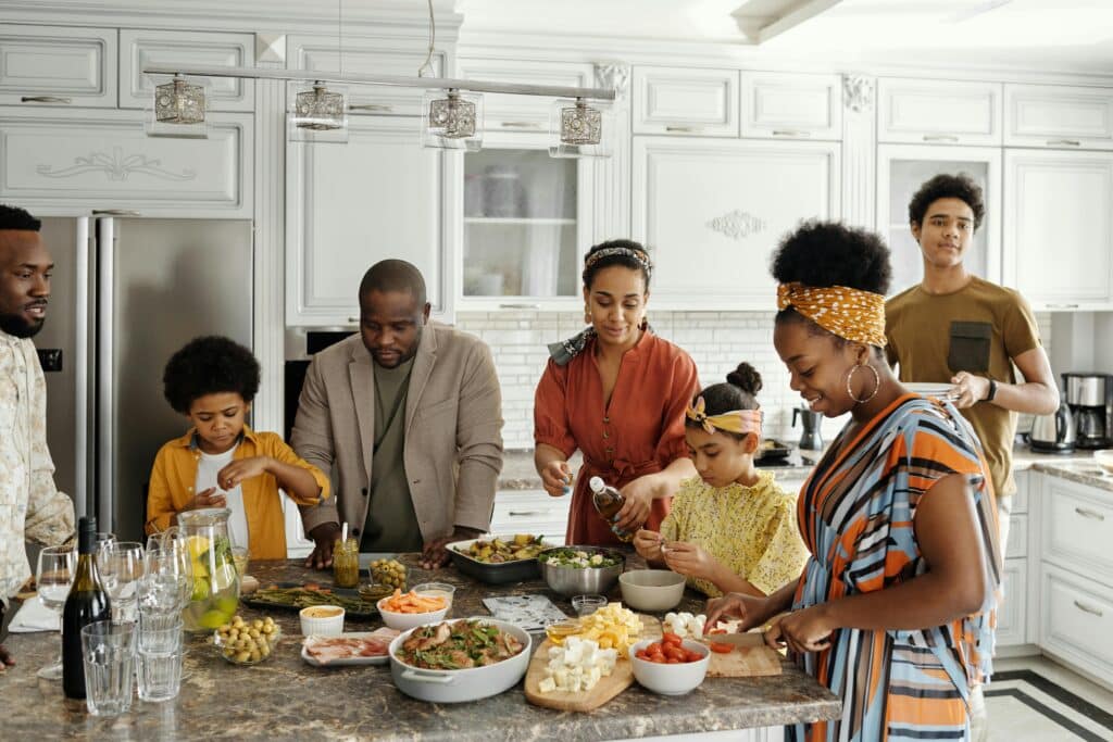 Simple yet meaningful ways kids can show appreciation on National Parents Day | Mark your calendars — because National Parents’ Day lands on Sunday, July 27. Parenting family eating dinner in kitchen
