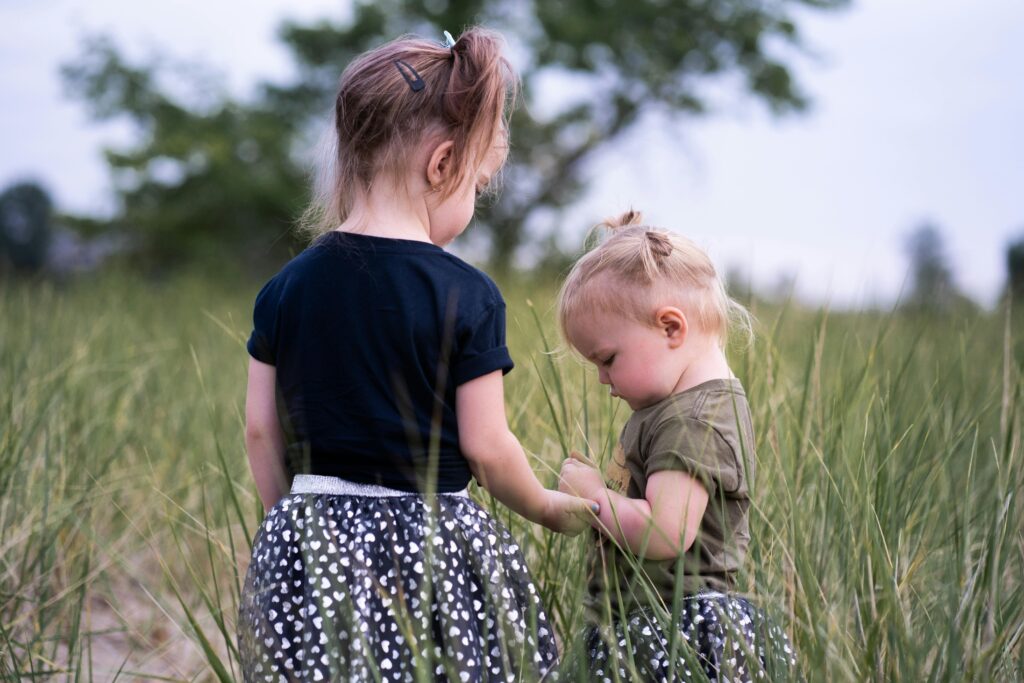 two sisters playing outside