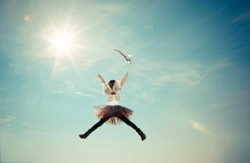 young girl dressed as fairy jumping in air tooth fairy ideas