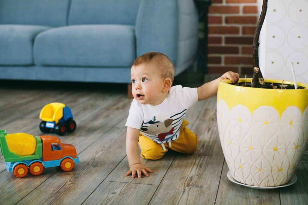 baby boy playing toys floor