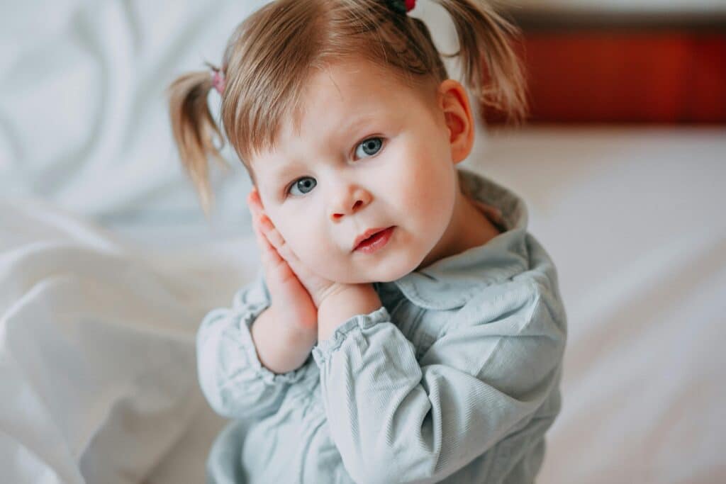 baby girl with hands on face girl names that start with f
