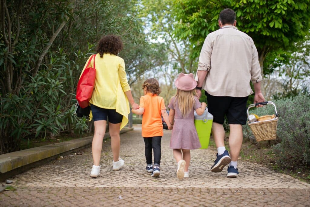 Adorable family picnic food ideas to celebrate National Eat Outside Day | National Eat Outside Day is almost here — and it’s the perfect excuse to round up the family for a picnic. Food family walking to a picnic