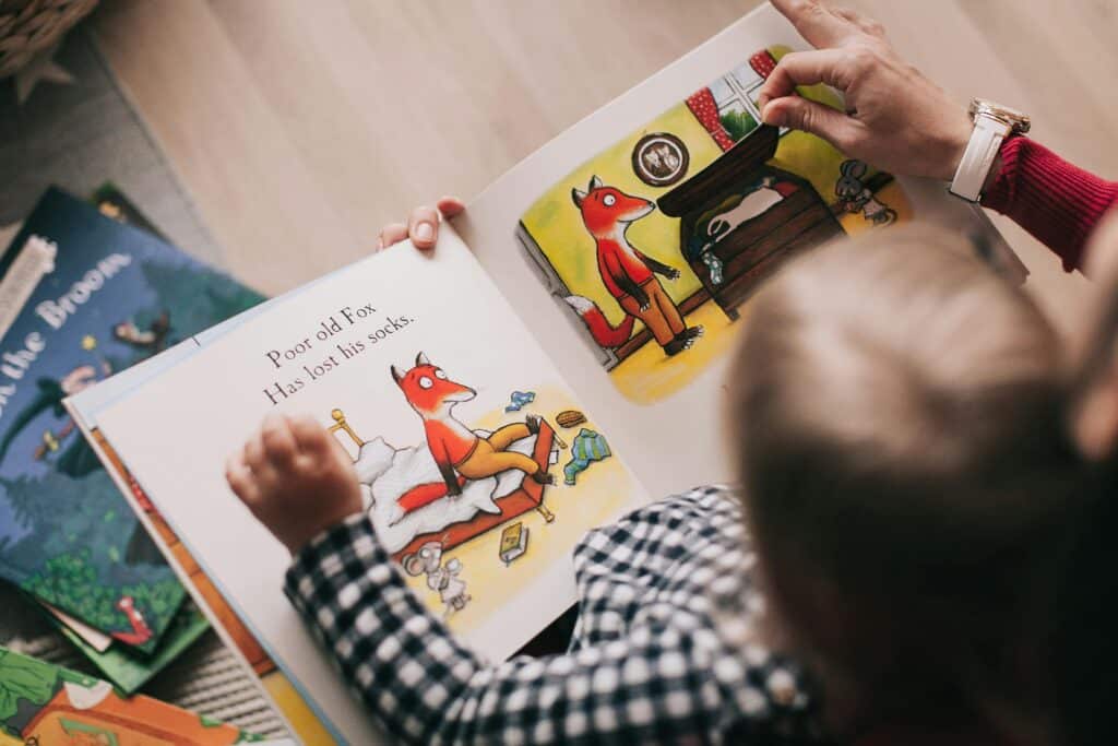 toddler reading childrens book