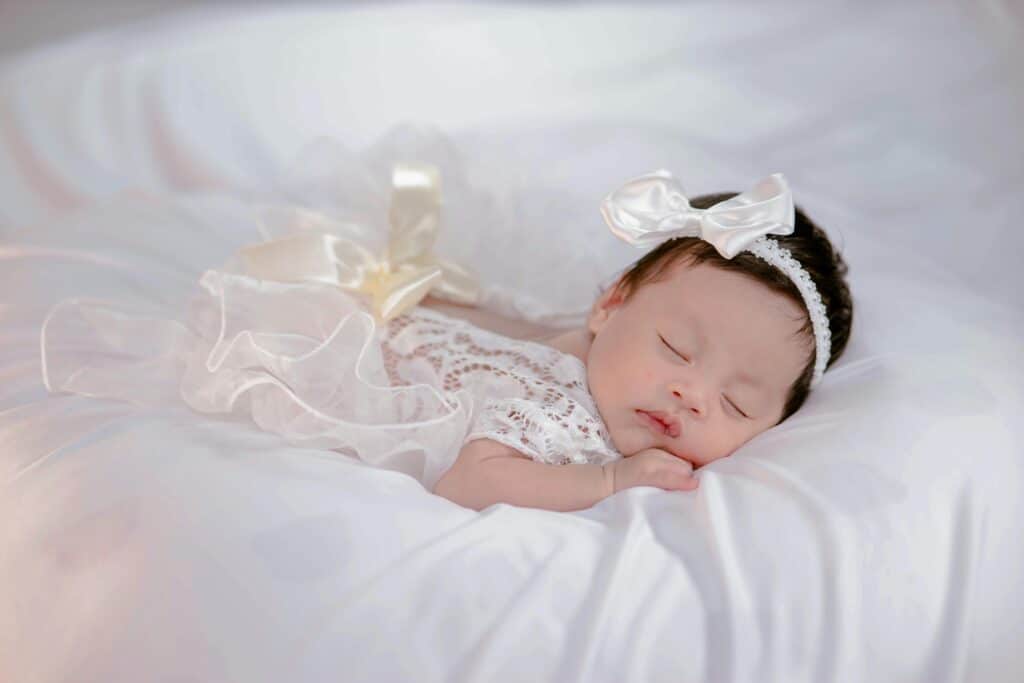 newborn baby girl white dress white bow goddess names for girls