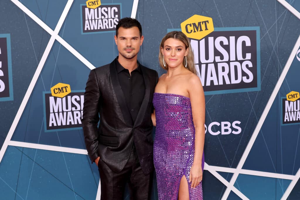 1390929060 taylor lautner with wife tay lautner at cmt music awards