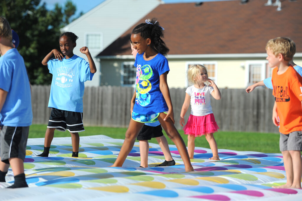 455202478 group of kids playing outside the 90s parenting