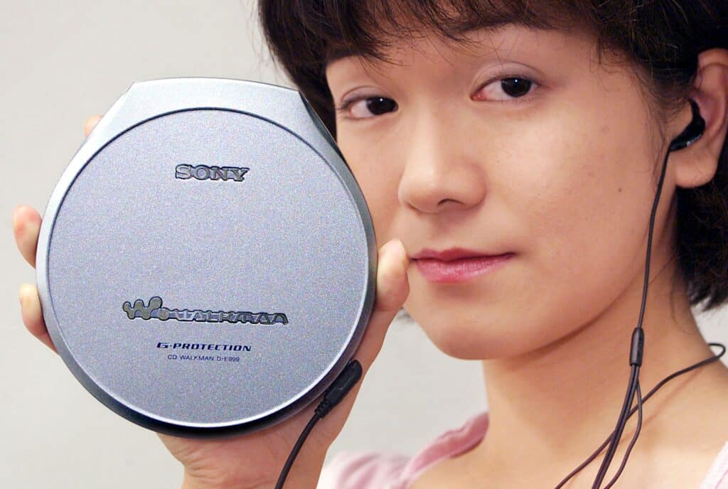 26 Nostalgic Sounds From Your Childhood That Kids Today May Never Hear Again 12 1661904114 woman holding old cd player nostalgic sounds