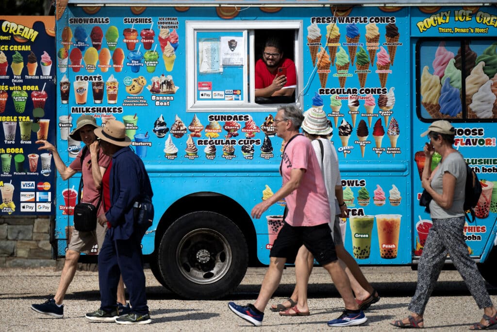 26 Nostalgic Sounds From Your Childhood That Kids Today May Never Hear Again 22 2168100708 people walking by ice cream truck nostalgic sounds