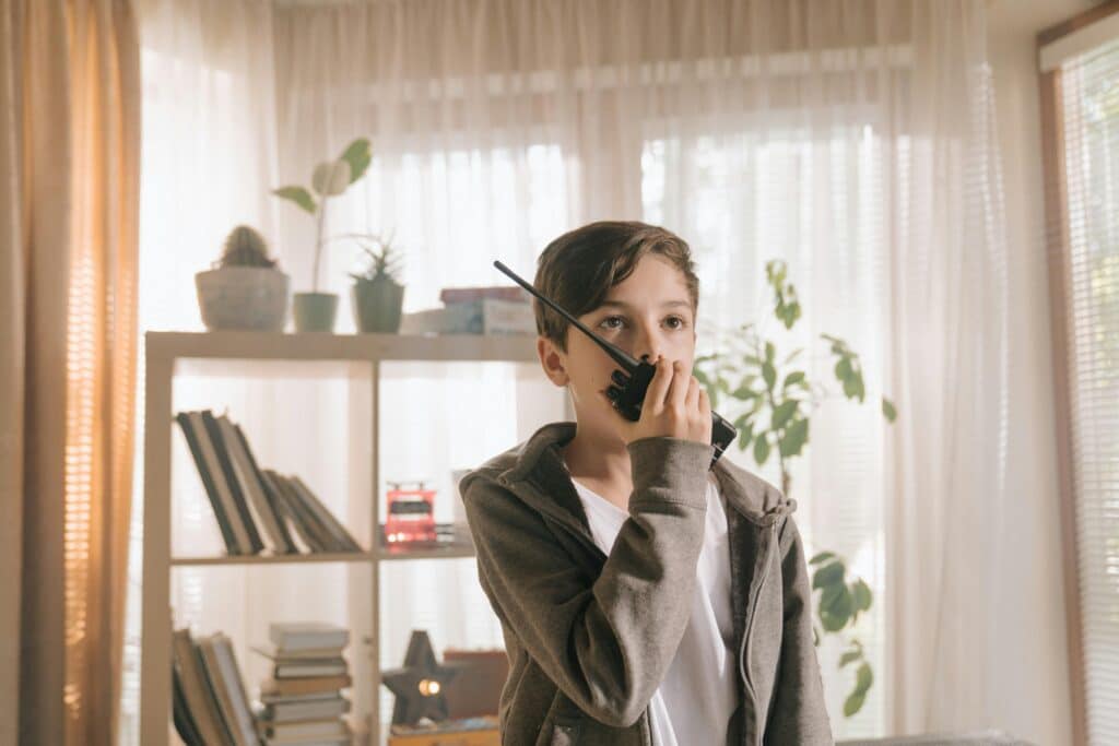 26 Nostalgic Sounds From Your Childhood That Kids Today May Never Hear Again 16 kid speaking into walkie talkie nostalgic sounds