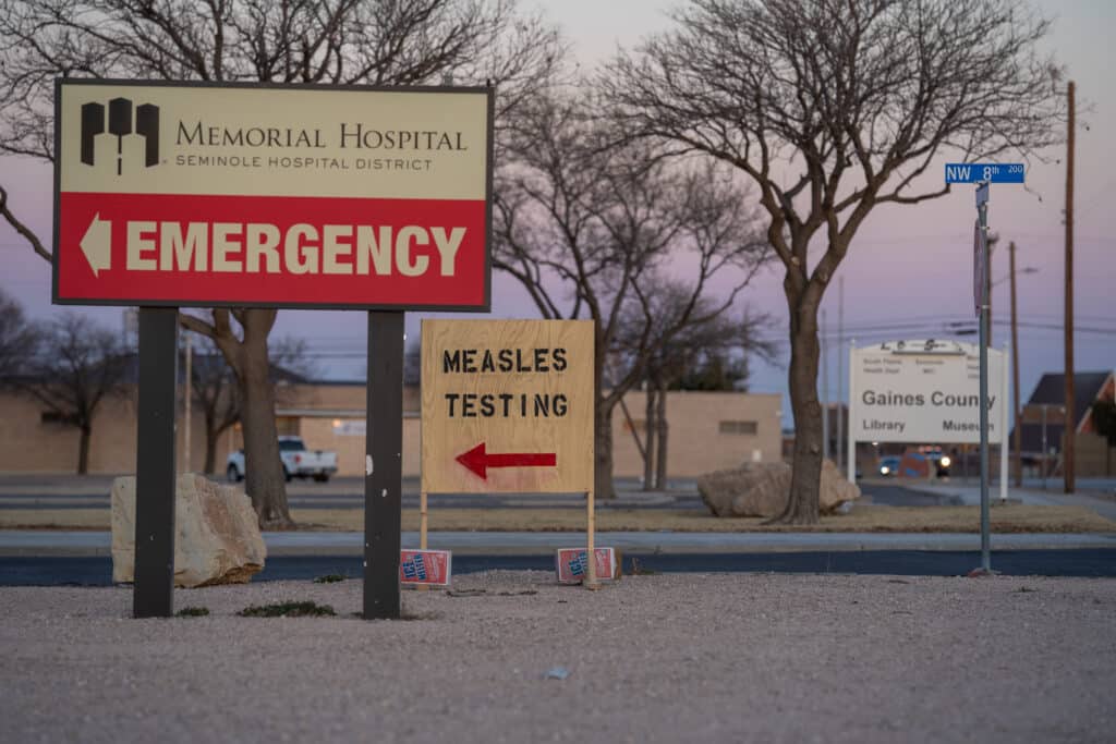 2201702057 emergency sign next to measles testing clinic