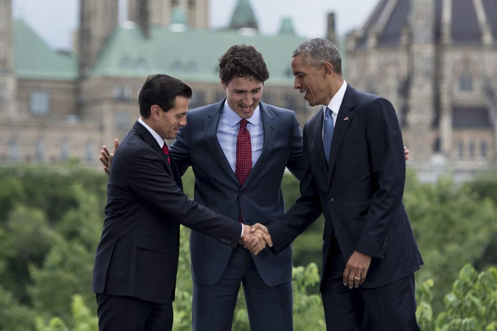 543621462 barack obama shakes hands with enrique pena nieto and justin trudeau at paris agreement