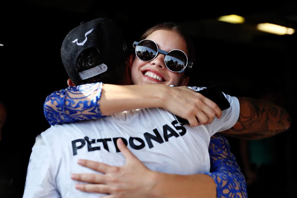 BUDAPEST, HUNGARY - JULY 24: Lewis Hamilton of Great Britain and Mercedes GP gets a congratulatory hug from model Barbara Palvin during the Formula One Grand Prix of Hungary at Hungaroring on July 24, 2016 in Budapest, Hungary. (Photo by Mark Thompson/Getty Images)