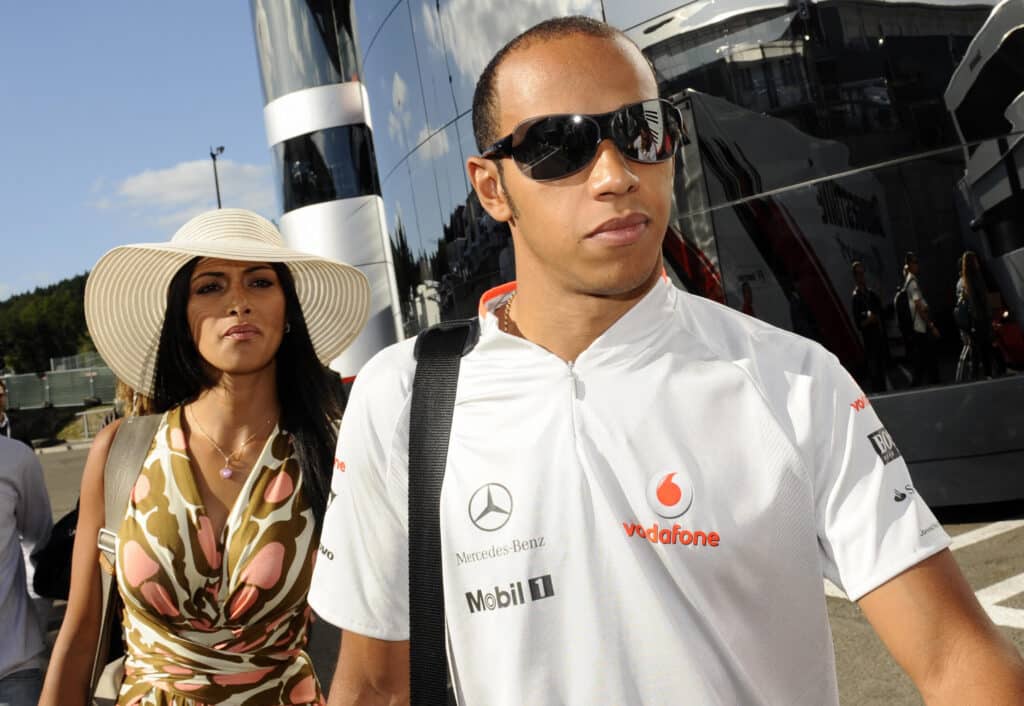 McLaren Mercedes' British driver Lewis Hamilton and his girlfriend, Nicole Scherzinger, singer of the band Pussycat Dolls, walk in the paddock of the Spa-Francorchamps Circuit on August 30, 2009 in Francorchamps, after the Formula One Belgian Grand Prix.               AFP PHOTO / JOHN THYS (Photo credit should read JOHN THYS/AFP via Getty Images)